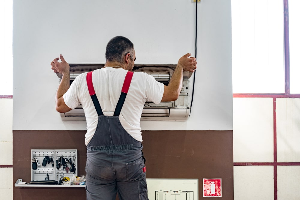 HVAC Contractor Checking Air Conditioning Unit